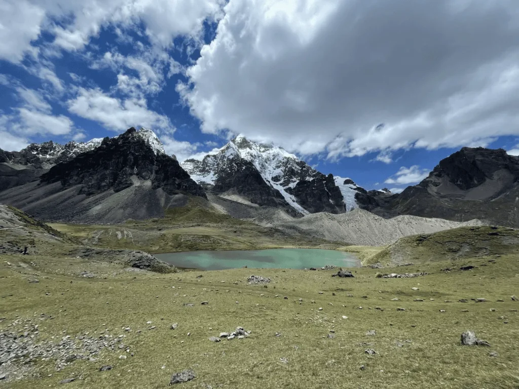 Mountain lake and snow-covered peaks seen during the Ausangate 7 Lakes hike in Peru