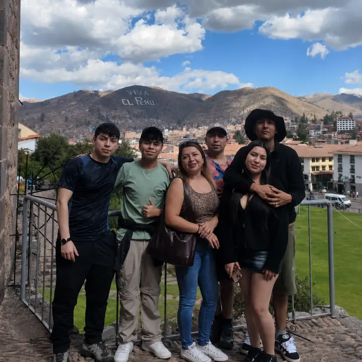 Family group enjoying a panoramic view of Cusco and the surrounding Andes.