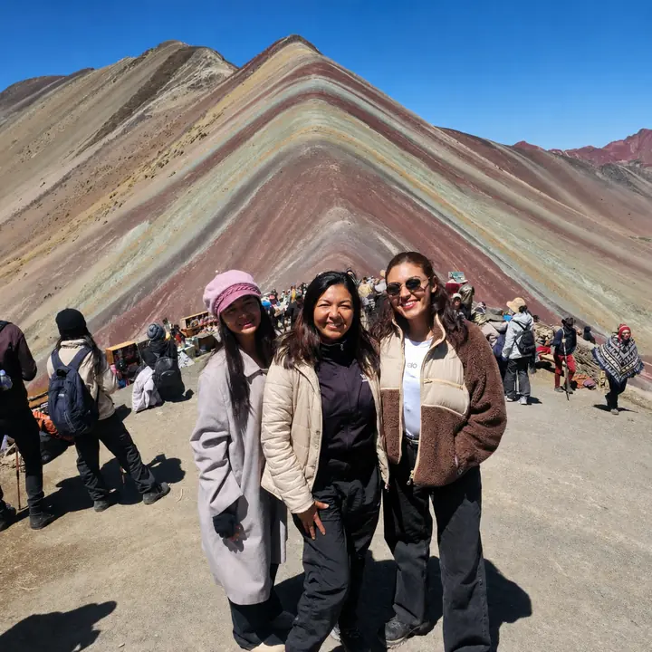 Three women visiting Vinicunca Rainbow Mountain near Cusco.