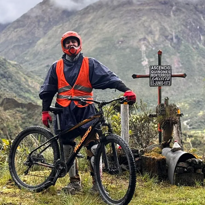 Cyclist with a mountain bike on the Inca Jungle trail in Peru.
